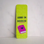 Green book with 'Sorry I'm Booked' text on a white background
