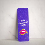 Purple bookmark with 'Talk Bookish To Me' text and a lips graphic on a white background