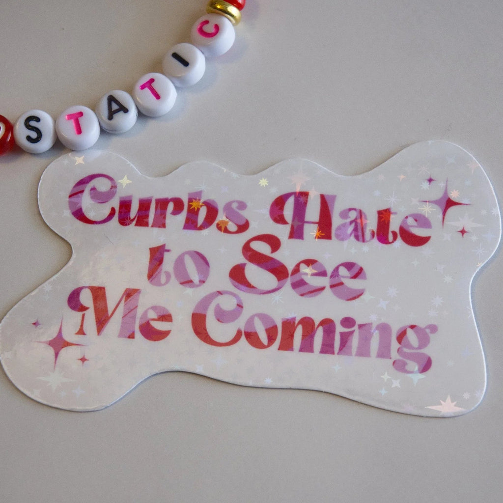 Dog tag with 'Curbs Hate to See Me Coming' text on a plain background
