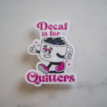 Sticker with cartoon coffee cup character and text 'Decaf is for Quitters' on a light gray background