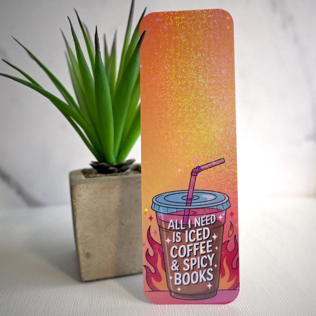 Bookmark with iced coffee and spicy books design next to a plant