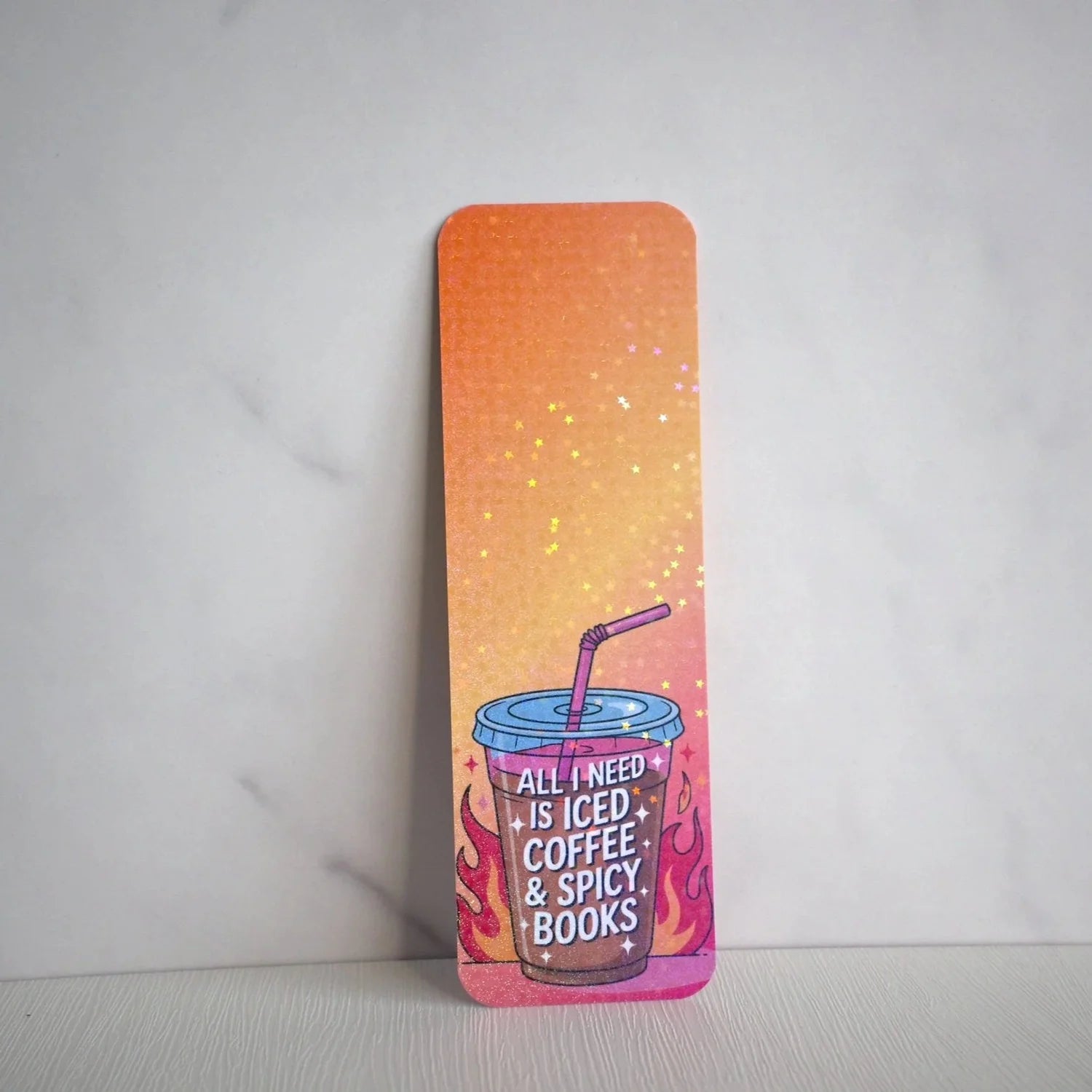 Colorful bookmark with a coffee cup design and text on a white background